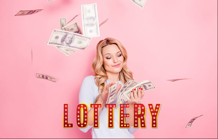 A woman holding a cash prize.
